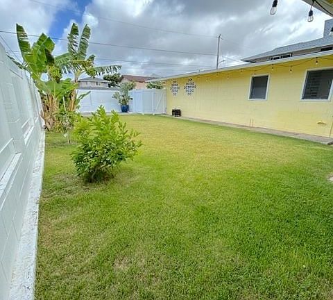 View of the front yard from the perspective of standing under the patio