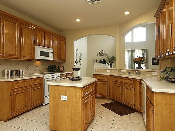 The kitchen is nicely sized and offers great cabinet space plus a convenient center island.