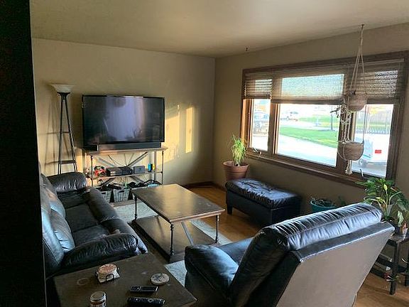 Living room. Entry door is to the right of the large window.