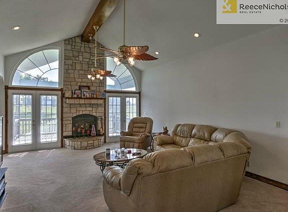 Vaulted great room provides a dramatic entry with double french