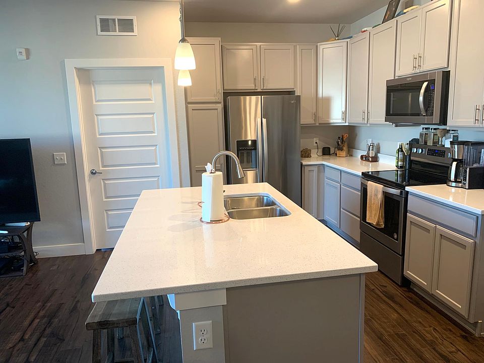 Kitchen with beautiful quartz counter-tops, brand new appliances