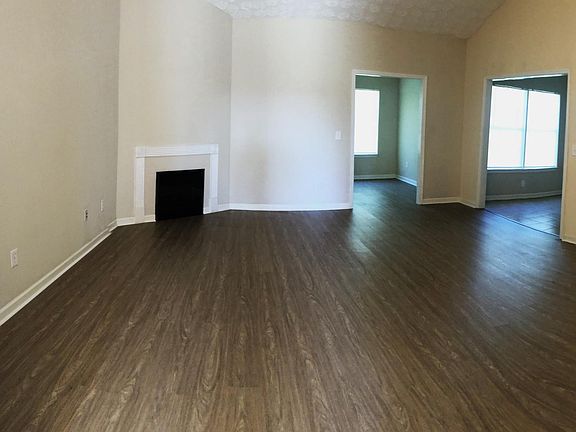 Vaulted living room with electric fireplace,