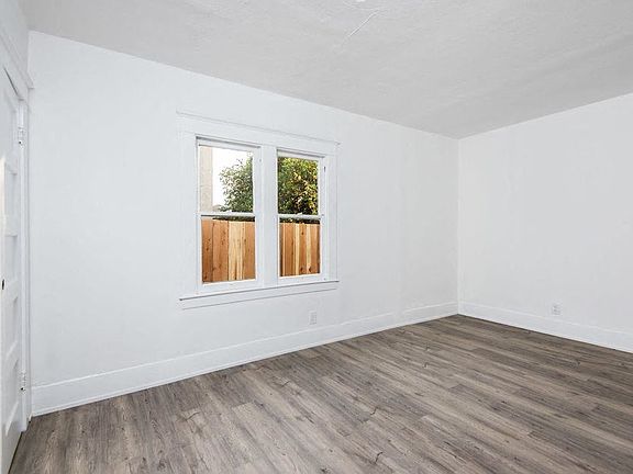 Lots of natural light in bedroom at 4141 Normal Avenue apartment homes in Los Angeles, California.