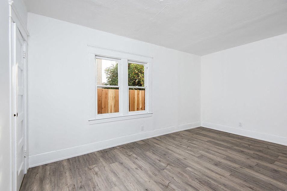 Lots of natural light in bedroom at 4141 Normal Avenue apartment homes in Los Angeles, California.