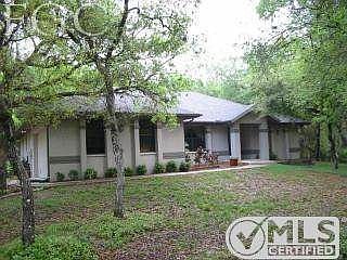 Front view. The front of this house is now significantly more wooded and overgrown.