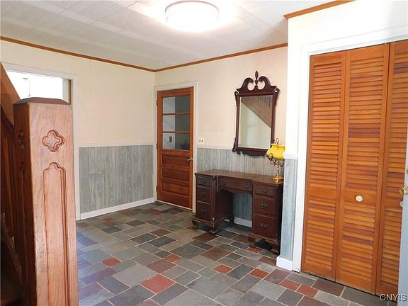 front entrance hallway and door to 1st floor bath