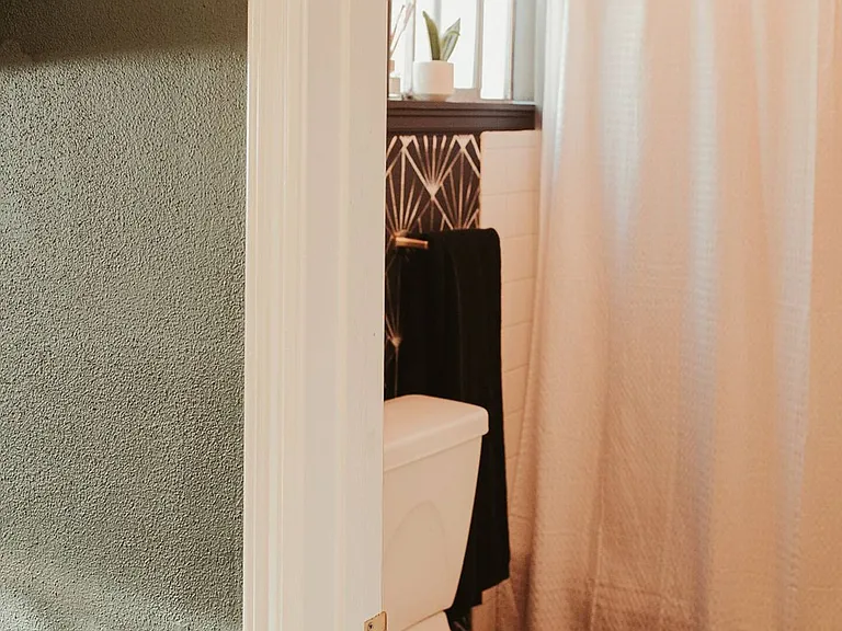 Full bathroom with storage cubbies