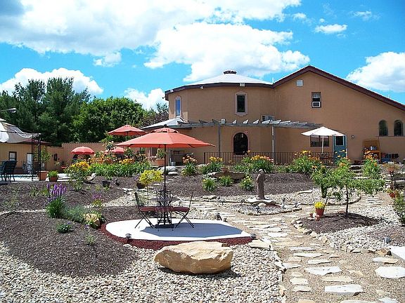 Back of house w/beautiful patio areas to entertain in 