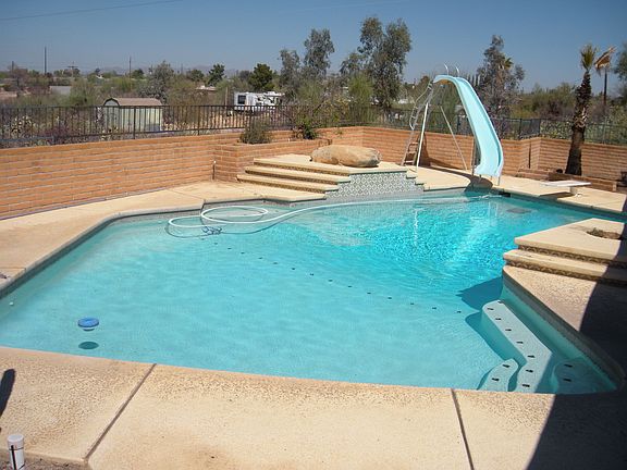 Large pool, fenced back yard, MT views sitting on 1.6+Acres.