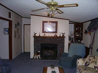 The living room features a propane fireplace.