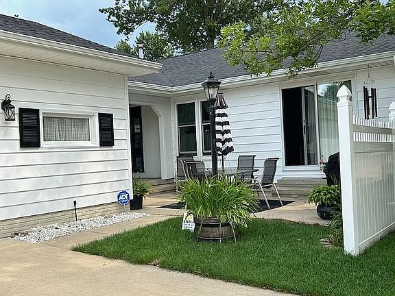 Driveway view of patio