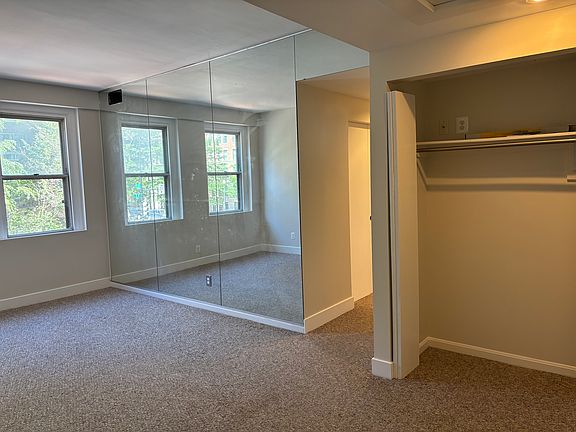 Living space is large with mirrors and closet