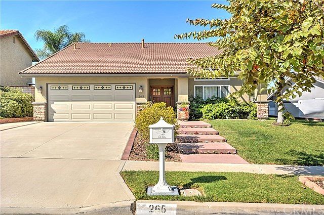 Stunning Curb Appeal, Stacked Stone Pilars, Long Driveway, Tile Roof. Covered Front Porch.