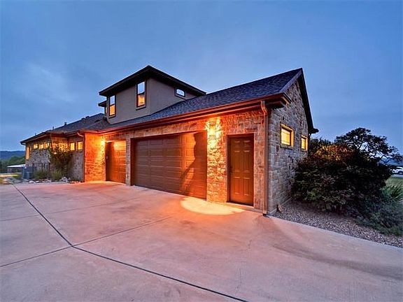 Over-sized Three Car Garage Plus Plenty of Additional Outdoor Parking Spaces. (not pictured)