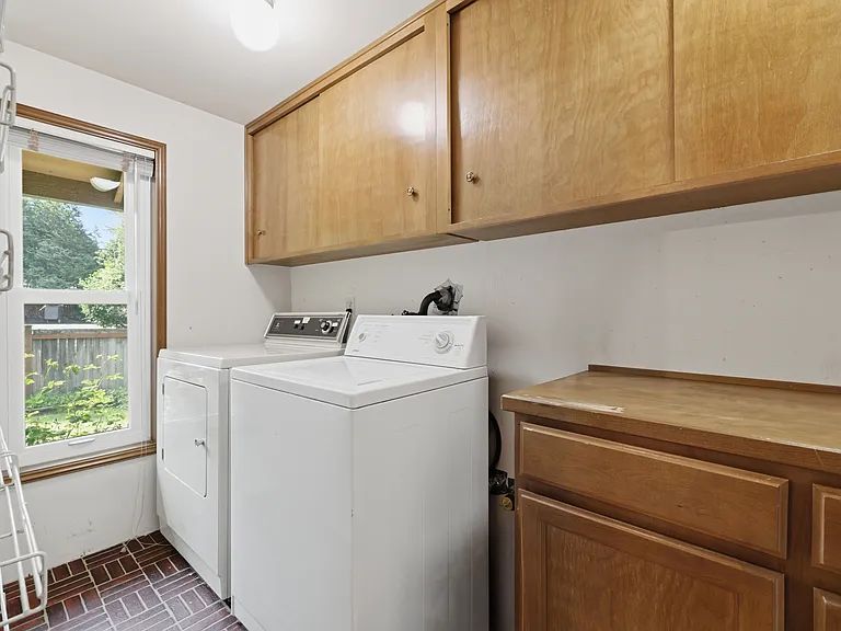 Dedicated laundry room with full-size washer and dryer included