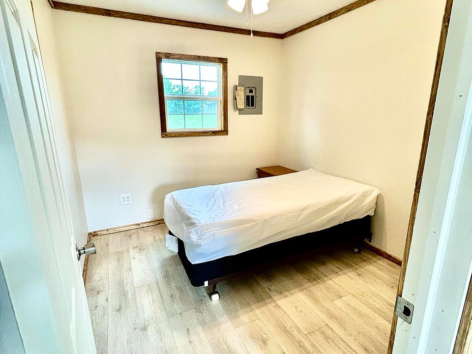 Bedroom from most recently built cabin. Can comfortably accommodate up to a queen-sized bed (pictured is a twin sized bed).