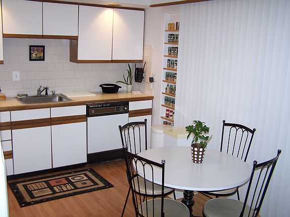 Modern Kitchen with atrium door leading to large deck