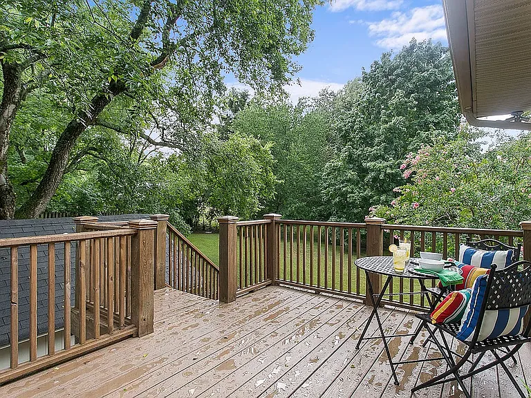 Upper deck overlooking the fenced backyard