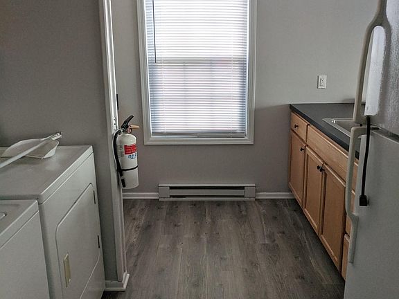 Galley kitchen with laundry on left