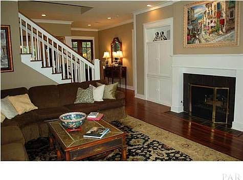 The stone surround gas fireplace, hardwood doors and custom built in cabinets add to the consistent design features