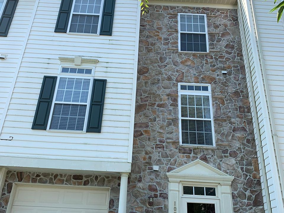 Stone front entrance with one car garage