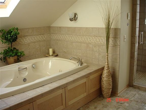 master bath, 12-jet tube, double steam shower, double sinks, stone heated flr