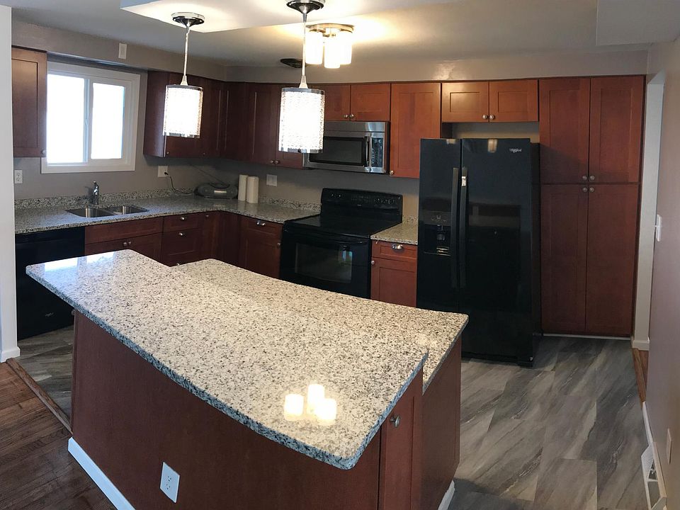 Beautiful kitchen with new appliances and tons of cabinet space featuring a two tier island
