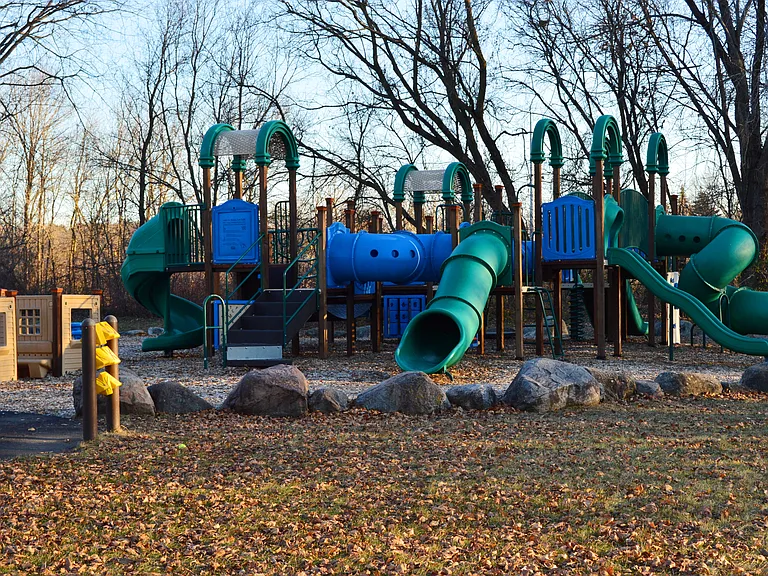 Playground across the street in a city River's Bend Park.