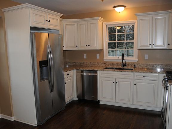 Stainless Steel Refrigerator with ice and water on the door.