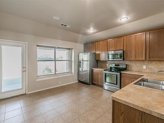 Eat in kitchen has abundant counter space and storage