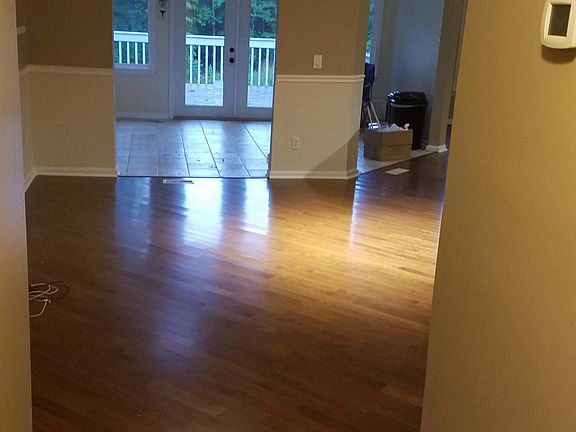 Front hallway (Entrance), having just stepped through the front door, looking through dining area into sunroom, and onward out to deck and back yard.