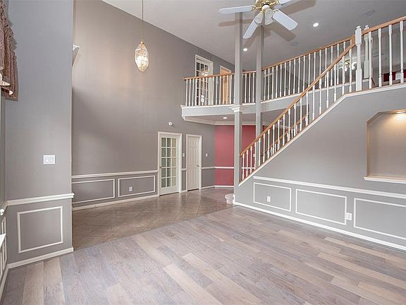 From the entry you can see the upstairs catwalk. The lighted niche in the living room is ideal for showcasing a work of art.