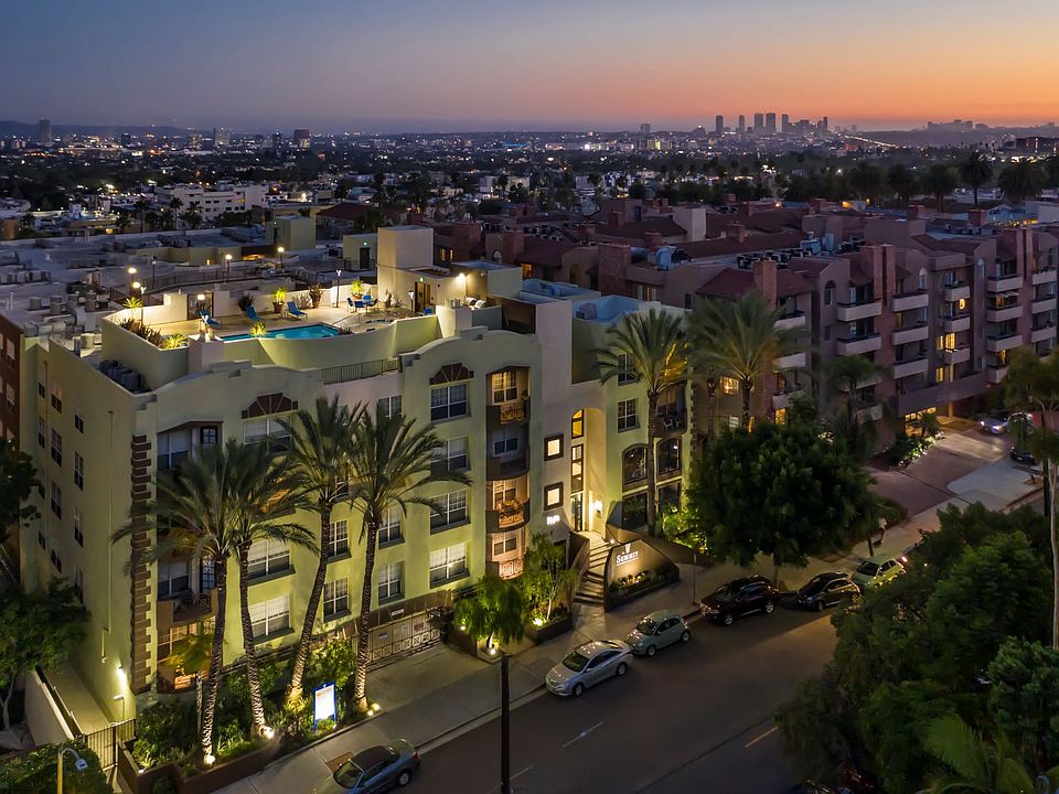 Apartments in Hollywood, CA - Elevated Night Time Lit Up View of Community with Rooftop Pool Area and Surrounding Areas summit.