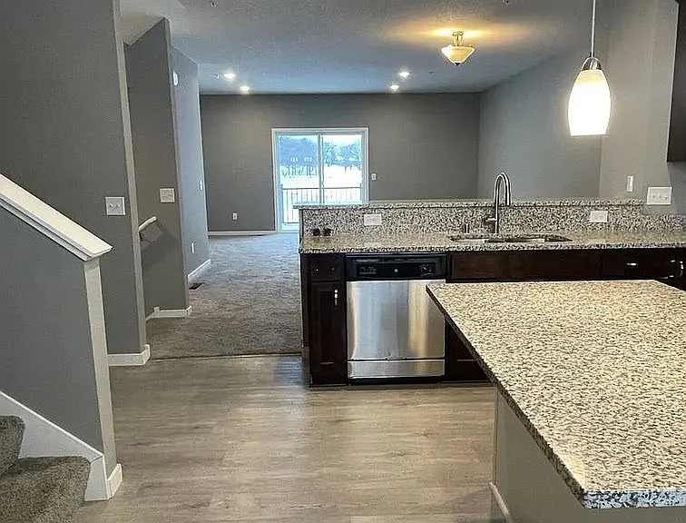Step into modern living with this stunning kitchen featuring granite countertops and sleek stainless steel appliances. The open layout seamlessly connects to the inviting living area, perfect for entertaining. Schedule your tour today at LS Capital Group!