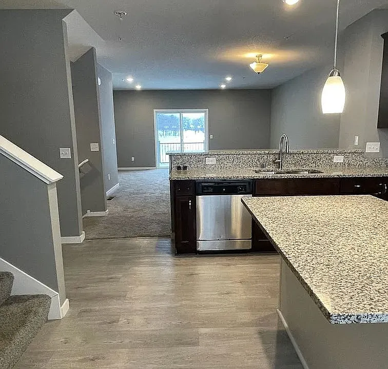 Step into modern living with this stunning kitchen featuring granite countertops and sleek stainless steel appliances. The open layout seamlessly connects to the inviting living area, perfect for entertaining. Schedule your tour today at LS Capital Group!