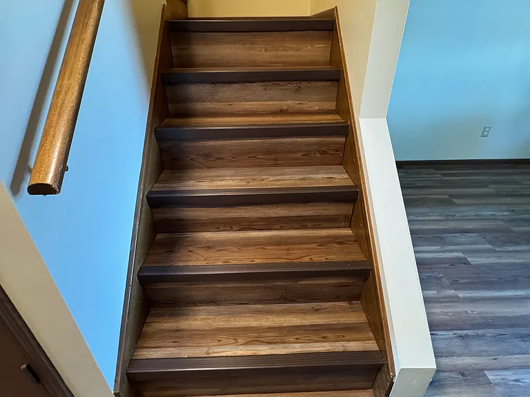 Stairs in living area leading to second floor