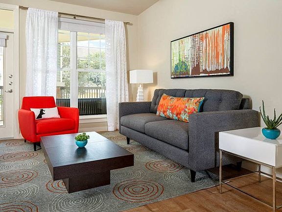 Living Room with balcony access and faux-wood flooring