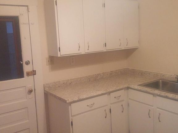 The kitchen features new counter tops and flooring!