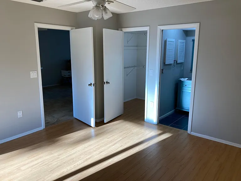 Guest bedroom with bathroom and large closet.