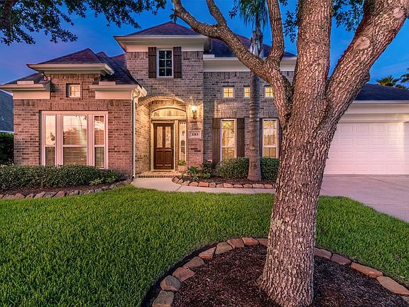 TWILIGHT VIEW OF THE FRONT OF THE HOME