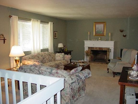 Bright and open formal living room with fireplace