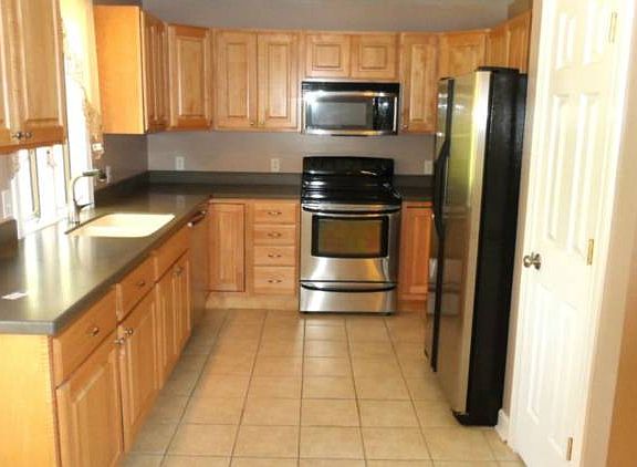 Kitchen has solid surface counters and plenty of them!