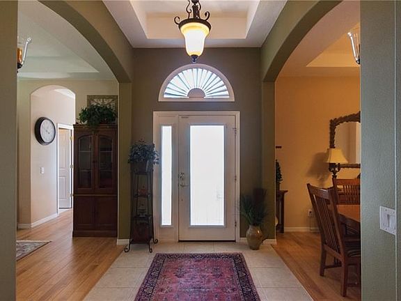 Dramatic entry with dining room and living room off the entrance.