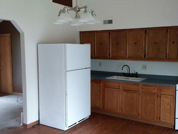 Eat in kitchen with lots of cabinets and access to garage