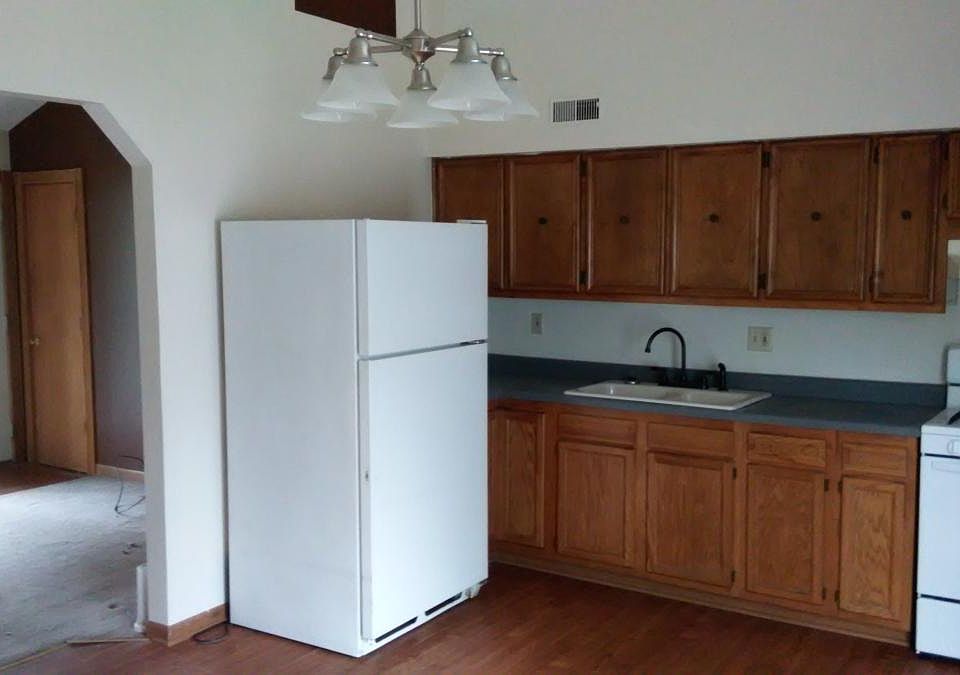 Eat in kitchen with lots of cabinets and access to garage