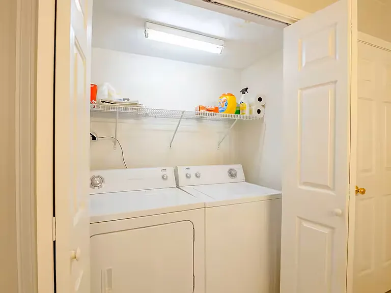 Full size washer and dryer readily accessible in kitchen. Drying rack available for delicates.