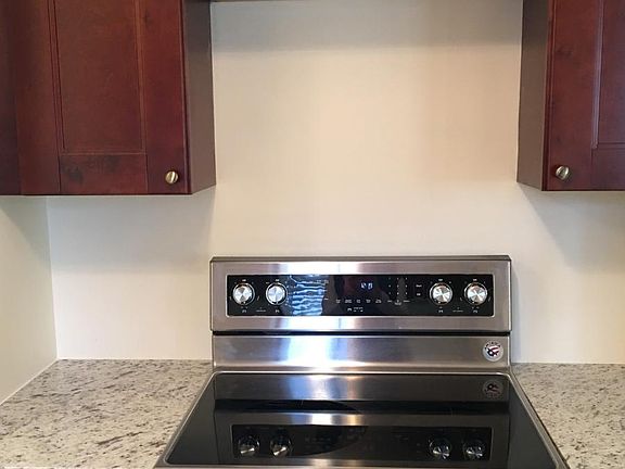 Brand new stove with cherry cabinets