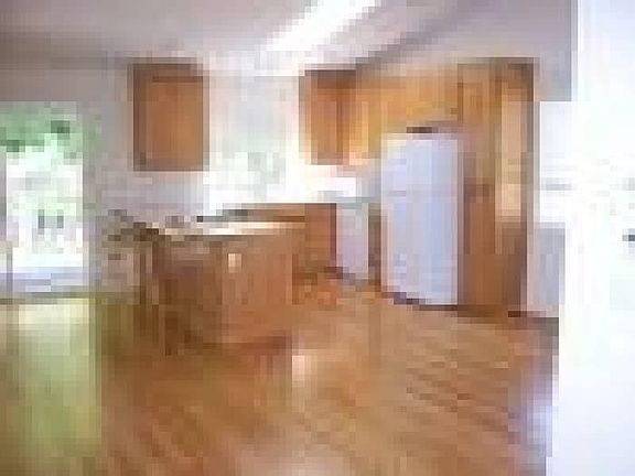 Kitchen, oak cabinets, oak hardwood floor.