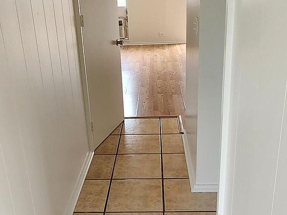 ENTRANCE TO KITCHEN AND LIVING ROOM