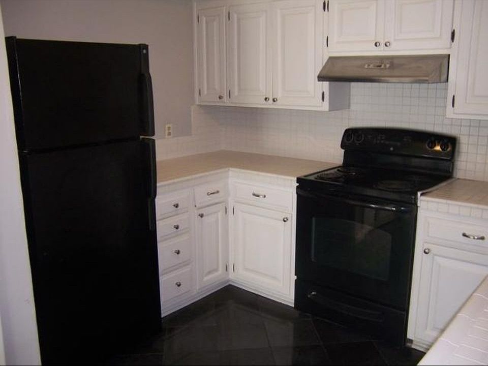 Kitchen with beautiful black granite/title floor